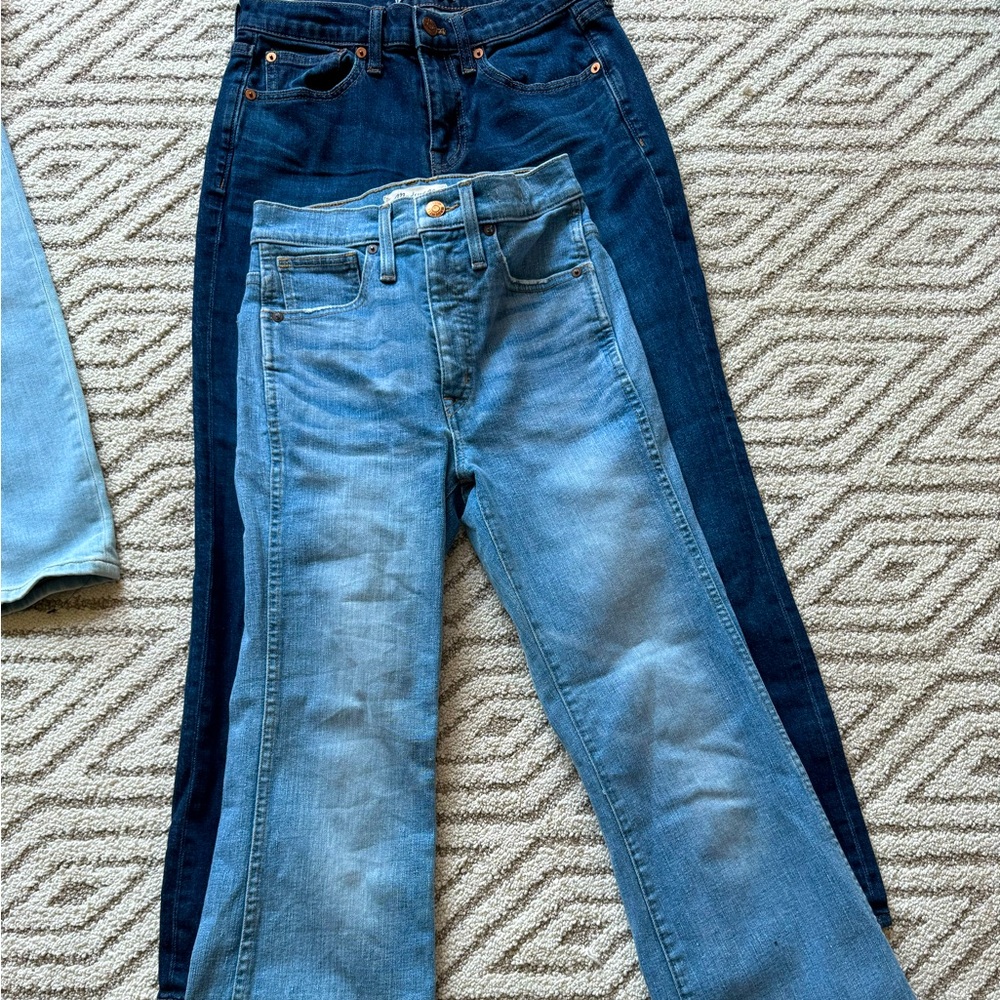 Two pairs of madewell jeans dark wash bootcut and light wash flared